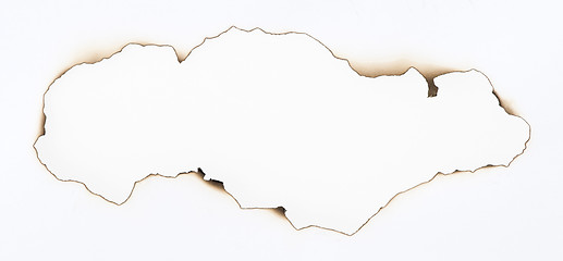 Image showing Burned paper and hole