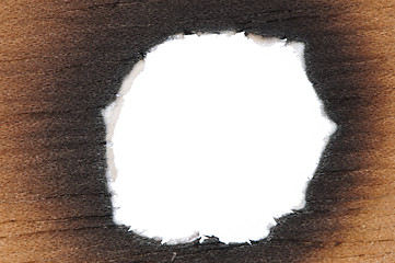 Image showing Burned wooden paper and hole