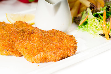 Image showing classic Milanese veal cutlets and vegetables