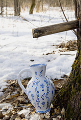 Image showing Collecting birch sap to ceramic pither