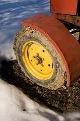 Image showing Yellow tractor wheel.