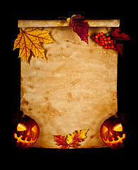 Image showing Halloween. Old paper with autumn leaves and pumpkin.