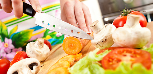 Image showing Woman's hands cutting vegetables