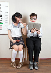 Image showing Two person wearing spectacles in an office at the doctor