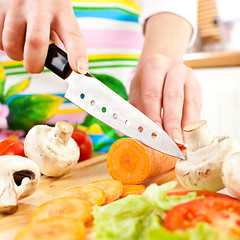 Image showing Woman's hands cutting vegetables