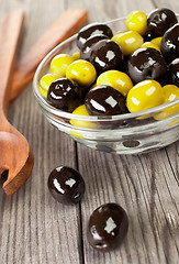 Image showing Olives on a wooden table