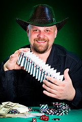 Image showing man skilfully shuffles playing cards