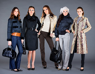Image showing Five girls. Autumn winter collection lady's clothes