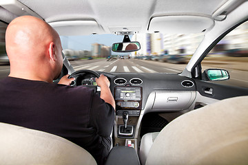 Image showing Driving a car