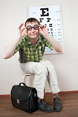 Image showing person wearing spectacles in an office at the doctor