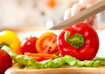 Image showing Woman's hands cutting vegetables