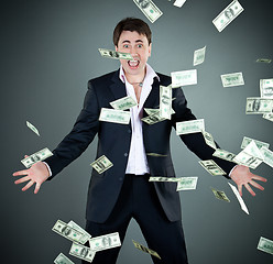 Image showing man in a suit throws money