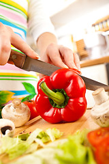 Image showing Woman's hands cutting vegetables