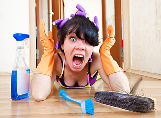 Image showing housewife washes a floor