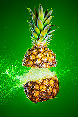 Image showing Pineapple splashed with water