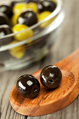 Image showing Olives on a wooden table