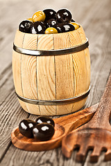 Image showing Olives on a wooden table