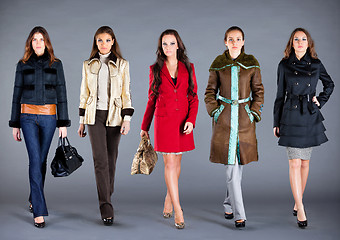 Image showing Five girls. Autumn winter collection lady's clothes