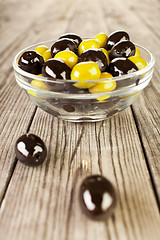 Image showing Olives on a wooden table