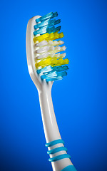 Image showing toothbrush on a dark blue background