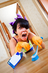 Image showing housewife washes a floor