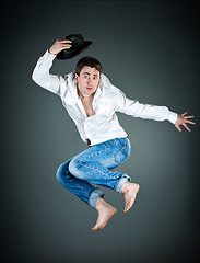 Image showing man with a hat in a jump