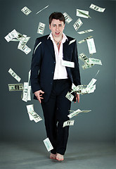 Image showing man in a suit throws money