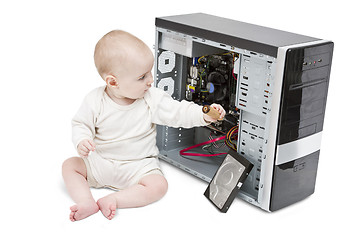 Image showing young child working on open computer