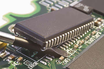 Image showing removing computer chip