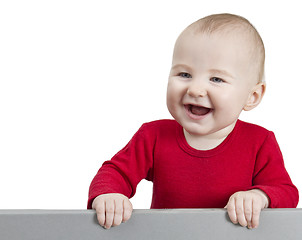 Image showing young happy child holding shield