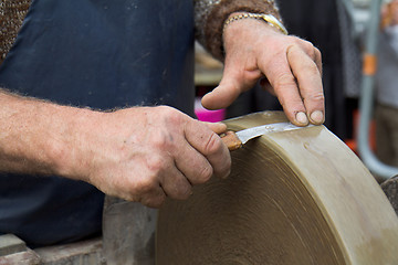 Image showing Blade against a grindstone