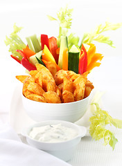 Image showing Raw vegetable and wedges with dip