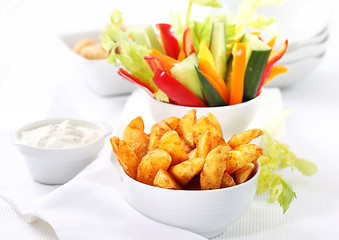 Image showing Raw vegetable and wedges with dip