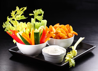 Image showing Raw vegetable and wedges with dip