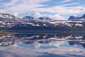 Image showing Snowy mountains by lake