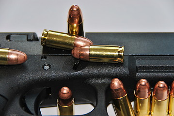 Image showing gun and bullets