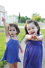 Image showing Beautiful little girls enjoying outside 