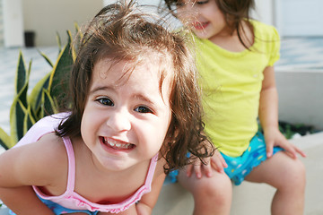 Image showing Sweet little girls in front of her little house for playtime (fo