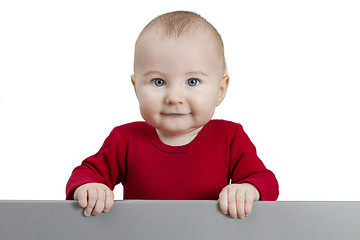 Image showing young child holding grey sign