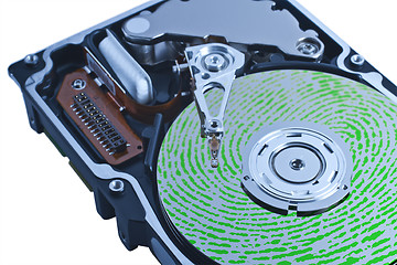 Image showing open hard drive with green fingerprint on platter