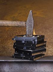Image showing hammer on burning hard disk