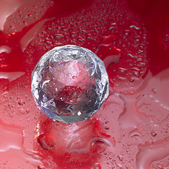Image showing diamond sphere in red wet ambiance