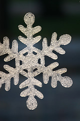 Image showing Christmas snowflake decoration on black background 