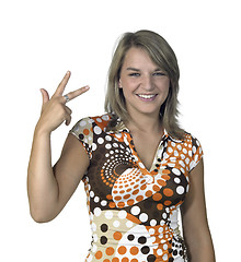 Image showing smiling blond girl showing three fingers