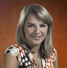 Image showing smiling young girl portrait in brown back