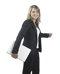 Image showing young business woman holding a laptop