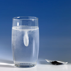 Image showing dissolving fizzy tablet in a glass of water
