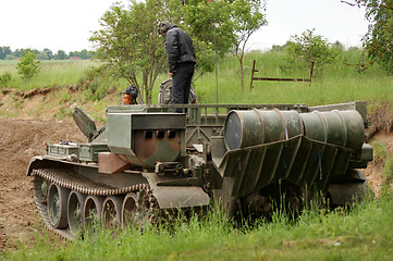 Image showing offroad scenery with driving tank