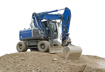 Image showing blue digger on earth pile