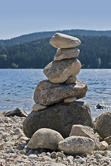Image showing waterside scenery with pebble pile